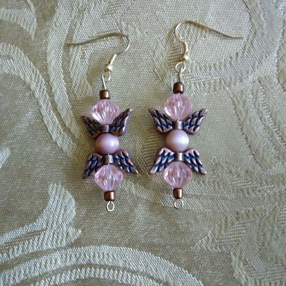 Earrings. 1 1/2 in Long. Clear pink glass beads wi